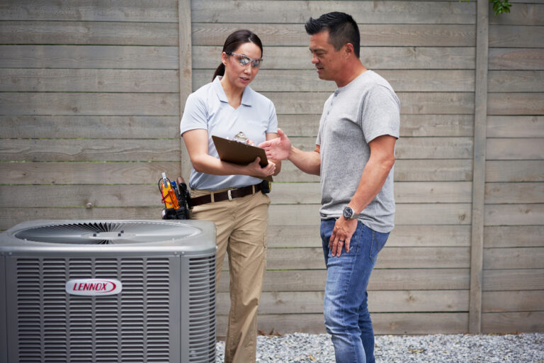 Technician and customer infront of lennox unit